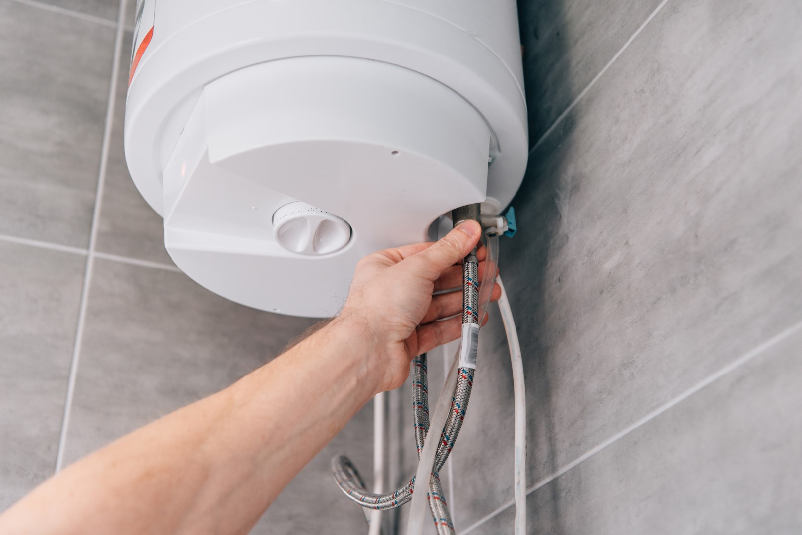 plumber connecting braided hose to hot water tank 2026 03 13 01 18 02 utc Large