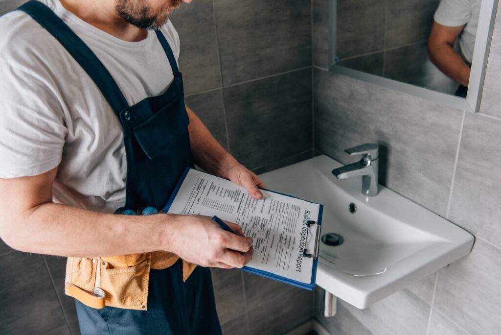 partial view of male plumber with toolbelt writing 2026 01 06 00 44 23 utc Large
