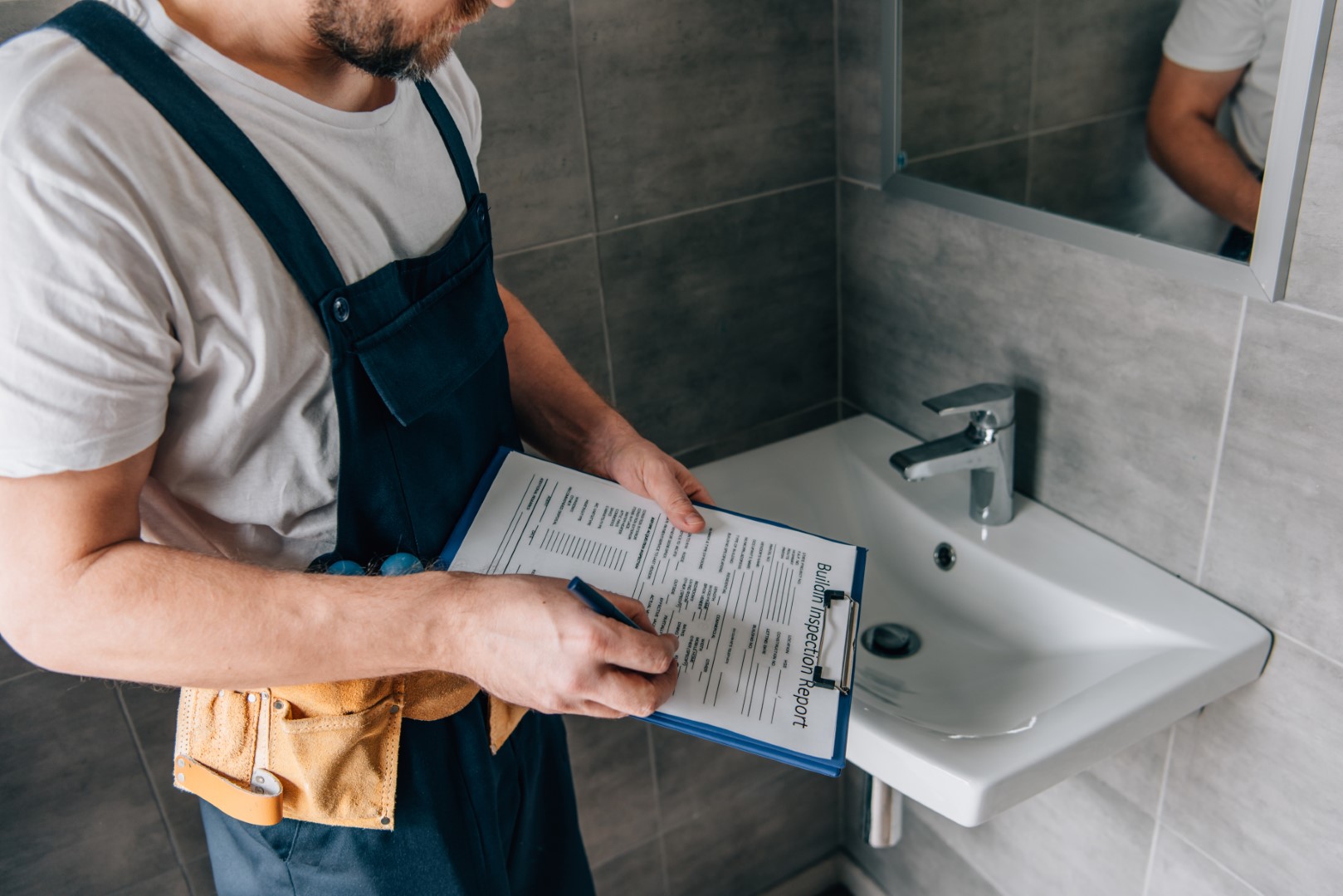 partial view of male plumber with toolbelt writing 2026 01 06 00 44 23 utc Large